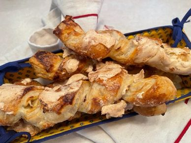 Sacristains (Puff pastry with sliced almonds and royal icing)